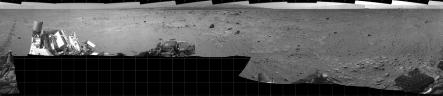 NASA's Mars rover Curiosity took 17 images in Gale Crater using its mast-mounted Left Navigation Camera (Navcam) to create this mosaic. The seam-corrected mosaic provides a 360-degree cylindrical projection panorama of the Martian surface centered at 180 degrees azimuth (measured clockwise from north). Curiosity took the images on August 22, 2013, Sol 371 of the Mars Science Laboratory mission at drive 974, site number 13. The local mean solar time for the image exposures was from 2 PM to 3 PM. Each Navcam image has a 45 degree field of view. CREDIT: NASA/JPL-Caltech