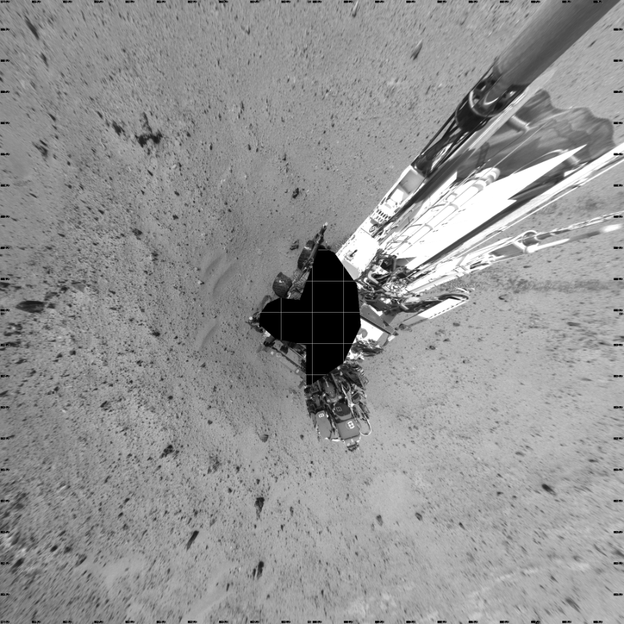 NASA's Mars rover Curiosity took 19 images in Gale Crater using its mast-mounted Left Navigation Camera (Navcam) to create this mosaic. The seam-corrected mosaic provides a vertical projection of the Martian surface near the rover, covering an area of 20 meters (north/south) by 20 meters (east/west). North is up in the image. This projection provides an overhead view, but introduces distortion for items not on the surface, such as large rocks and the rover itself.  Curiosity took the images on August 23, 2013, Sol 372 of the Mars Science Laboratory mission at drive 0, site number 14. The local mean solar time for the image exposures was 2 PM. Each Navcam image has a 45-degree field of view. CREDIT: NASA/JPL-Caltech