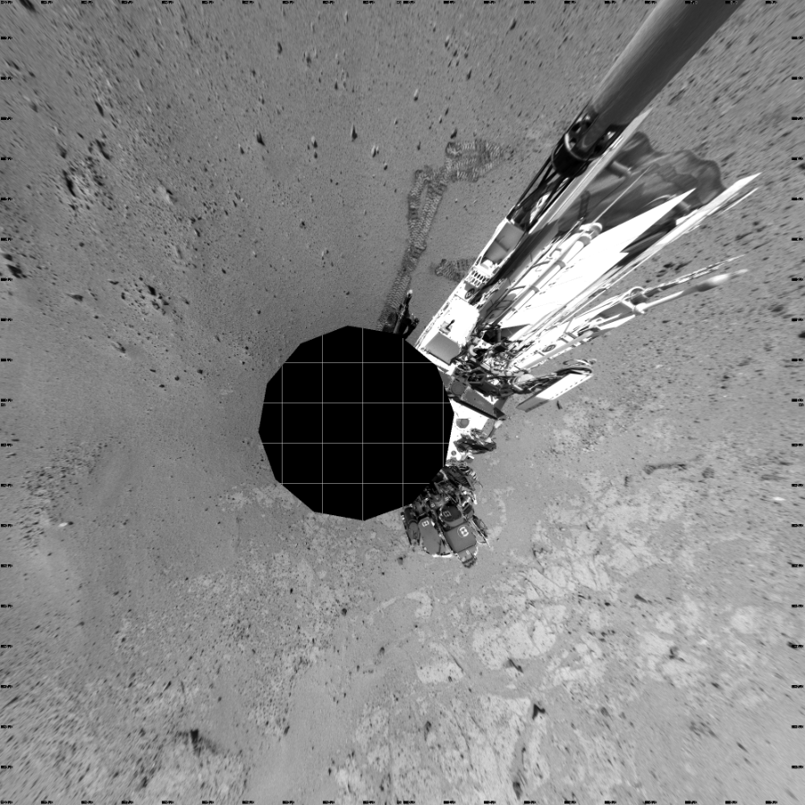 NASA's Mars rover Curiosity took 12 images in Gale Crater using its mast-mounted Left Navigation Camera (Navcam) to create this mosaic. The seam-corrected mosaic provides a vertical projection of the Martian surface near the rover, covering an area of 20 meters (north/south) by 20 meters (east/west). North is up in the image. This projection provides an overhead view, but introduces distortion for items not on the surface, such as large rocks and the rover itself.  Curiosity took the images on September 27, 2013, Sols 406-408 of the Mars Science Laboratory mission at drive 0, site number 17. The local mean solar time for the image exposures was 2 PM. Each Navcam image has a 45-degree field of view. CREDIT: NASA/JPL-Caltech