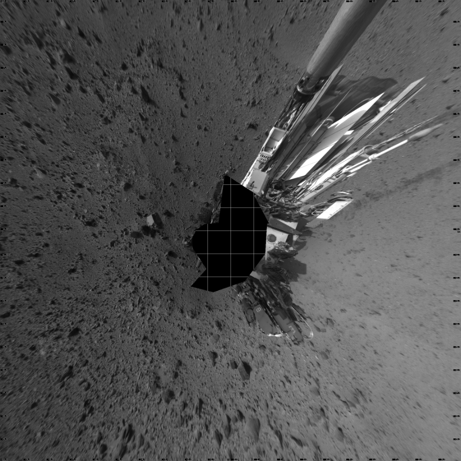 NASA's Mars rover Curiosity took 17 images in Gale Crater using its mast-mounted Left Navigation Camera (Navcam) to create this mosaic. The seam-corrected mosaic provides a vertical projection of the Martian surface near the rover, covering an area of 20 meters (north/south) by 20 meters (east/west). North is up in the image. This projection provides an overhead view, but introduces distortion for items not on the surface, such as large rocks and the rover itself.  Curiosity took the images on October 18, 2013, Sol 426 of the Mars Science Laboratory mission at drive 0, site number 20. The local mean solar time for the image exposures was 4 PM. Each Navcam image has a 45-degree field of view. CREDIT: NASA/JPL-Caltech