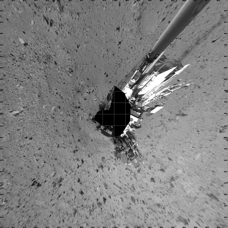 NASA's Mars rover Curiosity took 19 images in Gale Crater using its mast-mounted Left Navigation Camera (Navcam) to create this mosaic. The seam-corrected mosaic provides a vertical projection of the Martian surface near the rover, covering an area of 20 meters (north/south) by 20 meters (east/west). North is up in the image. This projection provides an overhead view, but introduces distortion for items not on the surface, such as large rocks and the rover itself.  Curiosity took the images on January 17, 2014, Sol 515 of the Mars Science Laboratory mission at drive 750, site number 25. The local mean solar time for the image exposures was 1 PM. Each Navcam image has a 45-degree field of view. CREDIT: NASA/JPL-Caltech