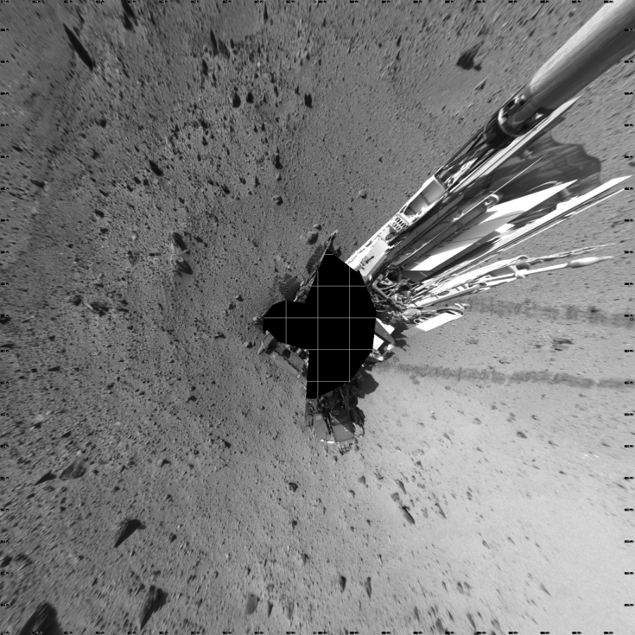 NASA's Mars rover Curiosity took 19 images in Gale Crater using its mast-mounted Left Navigation Camera (Navcam) to create this mosaic. The seam-corrected mosaic provides a vertical projection of the Martian surface near the rover, covering an area of 20 meters (north/south) by 20 meters (east/west). North is up in the image. This projection provides an overhead view, but introduces distortion for items not on the surface, such as large rocks and the rover itself. Curiosity took the images on January 27, 2014, Sol 524 of the Mars Science Laboratory mission at drive 1496, site number 25. The local mean solar time for the image exposures was 3 PM. Each Navcam image has a 45-degree field of view. CREDIT: NASA/JPL-Caltech