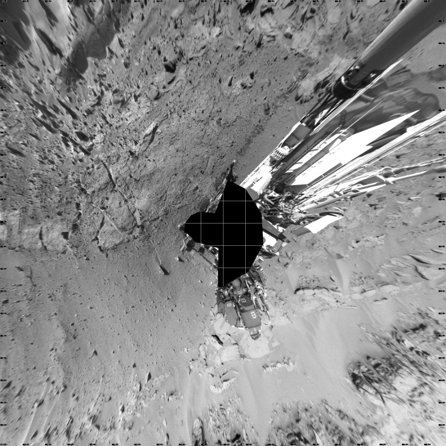 NASA's Mars rover Curiosity took 19 images in Gale Crater using its mast-mounted Left Navigation Camera (Navcam) to create this mosaic. The seam-corrected mosaic provides a vertical projection of the Martian surface near the rover, covering an area of 20 meters (north/south) by 20 meters (east/west). North is up in the image. This projection provides an overhead view, but introduces distortion for items not on the surface, such as large rocks and the rover itself.  Curiosity took the images on February 11, 2014, Sols 539-538 of the Mars Science Laboratory mission at drive 708, site number 26. The local mean solar time for the image exposures was from 1 PM to 3 PM. Each Navcam image has a 45-degree field of view. CREDIT: NASA/JPL-Caltech