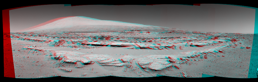NASA's Mars rover Curiosity took 5 image pairs in Gale Crater using its mast-mounted Navigation Camera (Navcam) to create this mosaic. The seam-corrected mosaic provides a 166-degree cylindrical perspective projection panorama of the Martian surface suitable for stereo viewing, centered at 94 degrees azimuth (measured clockwise from north). This anaglyph must be viewed with red/blue glasses (red over left eye). Curiosity took the images on February 20, 2014, Sol 548 of the Mars Science Laboratory mission at drive 802, site number 27. The local mean solar time for the image exposures was 1 PM. Each Navcam image has a 45-degree field of view. CREDIT: NASA/JPL-Caltech
