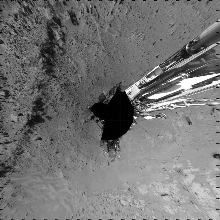 NASA's Mars rover Curiosity took 19 images in Gale Crater using its mast-mounted Left Navigation Camera (Navcam) to create this mosaic. The seam-corrected mosaic provides a vertical projection of the Martian surface near the rover, covering an area of 20 meters (north/south) by 20 meters (east/west). North is up in the image. This projection provides an overhead view, but introduces distortion for items not on the surface, such as large rocks and the rover itself.  Curiosity took the images on February 24, 2014, Sol 552 of the Mars Science Laboratory mission at drive 0, site number 28. The local mean solar time for the image exposures was 2 PM. Each Navcam image has a 45-degree field of view. CREDIT: NASA/JPL-Caltech