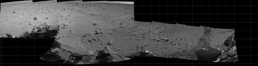 NASA's Mars rover Curiosity took 12 images in Gale Crater using its mast-mounted Left Navigation Camera (Navcam) to create this mosaic. The seam-corrected mosaic provides a 310-degree cylindrical projection panorama of the Martian surface centered at 254 degrees azimuth (measured clockwise from north). Curiosity took the images on March 04, 2014, Sol 559 of the Mars Science Laboratory mission at drive 914, site number 28. The local mean solar time for the image exposures was 2 PM. Each Navcam image has a 45 degree field of view. CREDIT: NASA/JPL-Caltech