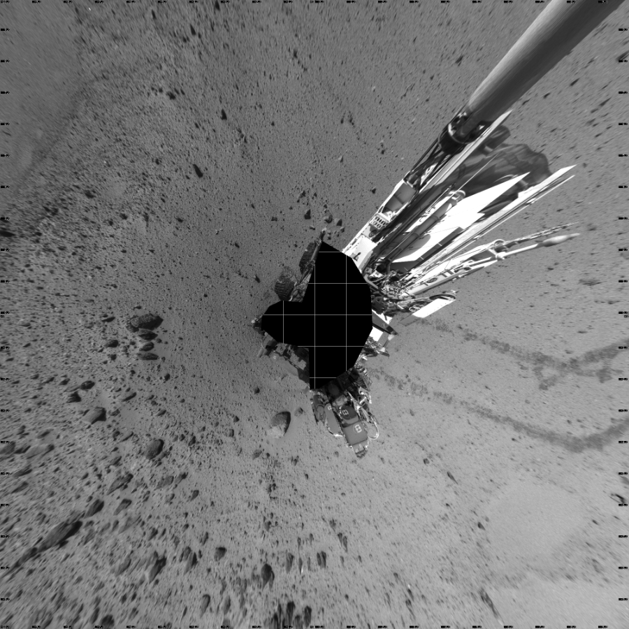 NASA's Mars rover Curiosity took 19 images in Gale Crater using its mast-mounted Left Navigation Camera (Navcam) to create this mosaic. The seam-corrected mosaic provides a vertical projection of the Martian surface near the rover, covering an area of 20 meters (north/south) by 20 meters (east/west). North is up in the image. This projection provides an overhead view, but introduces distortion for items not on the surface, such as large rocks and the rover itself.  Curiosity took the images on March 05, 2014, Sol 560 of the Mars Science Laboratory mission at drive 1122, site number 28. The local mean solar time for the image exposures was 2 PM. Each Navcam image has a 45-degree field of view. CREDIT: NASA/JPL-Caltech