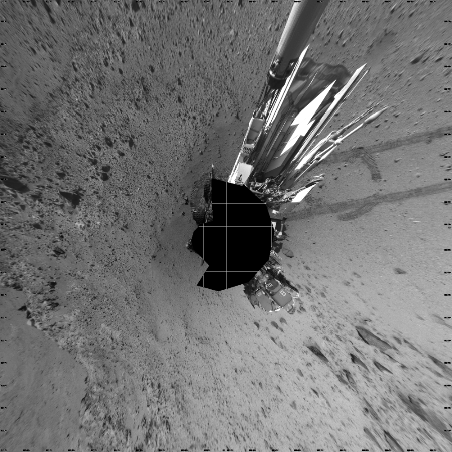 NASA's Mars rover Curiosity took 17 images in Gale Crater using its mast-mounted Left Navigation Camera (Navcam) to create this mosaic. The seam-corrected mosaic provides a vertical projection of the Martian surface near the rover, covering an area of 20 meters (north/south) by 20 meters (east/west). North is up in the image. This projection provides an overhead view, but introduces distortion for items not on the surface, such as large rocks and the rover itself.  Curiosity took the images on March 06, 2014, Sol 561 of the Mars Science Laboratory mission at drive 1350, site number 28. The local mean solar time for the image exposures was 2 PM. Each Navcam image has a 45-degree field of view. CREDIT: NASA/JPL-Caltech