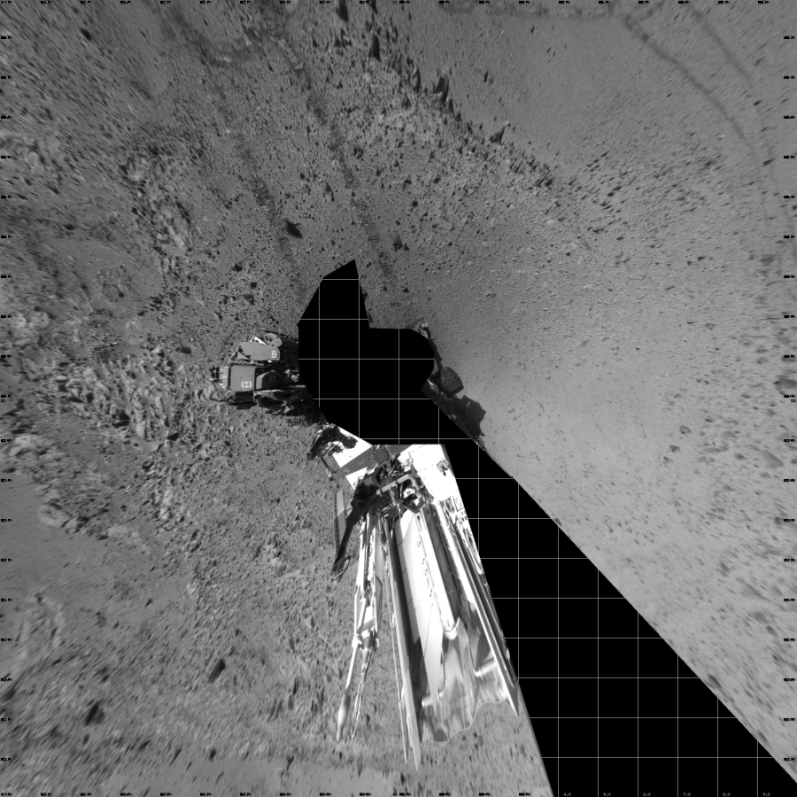 NASA's Mars rover Curiosity took 16 images in Gale Crater using its mast-mounted Left Navigation Camera (Navcam) to create this mosaic. The seam-corrected mosaic provides a vertical projection of the Martian surface near the rover, covering an area of 20 meters (north/south) by 20 meters (east/west). North is up in the image. This projection provides an overhead view, but introduces distortion for items not on the surface, such as large rocks and the rover itself.  Curiosity took the images on March 08, 2014, Sol 563 of the Mars Science Laboratory mission at drive 0, site number 29. The local mean solar time for the image exposures was from 2 PM to 3 PM. Each Navcam image has a 45-degree field of view. CREDIT: NASA/JPL-Caltech
