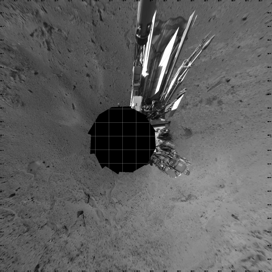 NASA's Mars rover Curiosity took 12 images in Gale Crater using its mast-mounted Left Navigation Camera (Navcam) to create this mosaic. The seam-corrected mosaic provides a vertical projection of the Martian surface near the rover, covering an area of 20 meters (north/south) by 20 meters (east/west). North is up in the image. This projection provides an overhead view, but introduces distortion for items not on the surface, such as large rocks and the rover itself.  Curiosity took the images on March 09, 2014, Sol 564 of the Mars Science Laboratory mission at drive 298, site number 29. The local mean solar time for the image exposures was from 2 PM to 4 PM. Each Navcam image has a 45-degree field of view. CREDIT: NASA/JPL-Caltech