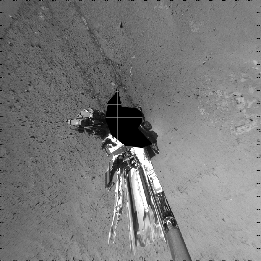 NASA's Mars rover Curiosity took 17 images in Gale Crater using its mast-mounted Left Navigation Camera (Navcam) to create this mosaic. The seam-corrected mosaic provides a vertical projection of the Martian surface near the rover, covering an area of 20 meters (north/south) by 20 meters (east/west). North is up in the image. This projection provides an overhead view, but introduces distortion for items not on the surface, such as large rocks and the rover itself.  Curiosity took the images on March 13, 2014, Sol 568 of the Mars Science Laboratory mission at drive 1020, site number 29. The local mean solar time for the image exposures was 2 PM. Each Navcam image has a 45-degree field of view. CREDIT: NASA/JPL-Caltech