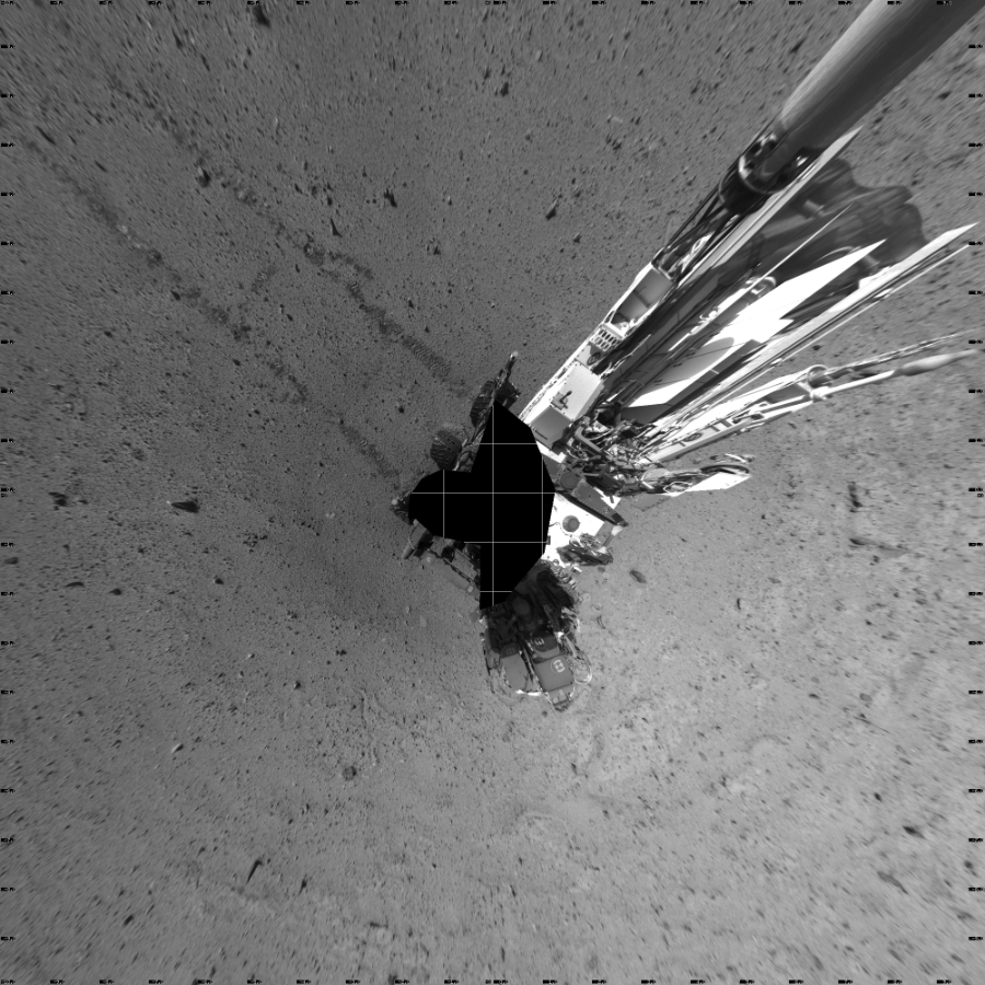 NASA's Mars rover Curiosity took 19 images in Gale Crater using its mast-mounted Left Navigation Camera (Navcam) to create this mosaic. The seam-corrected mosaic provides a vertical projection of the Martian surface near the rover, covering an area of 20 meters (north/south) by 20 meters (east/west). North is up in the image. This projection provides an overhead view, but introduces distortion for items not on the surface, such as large rocks and the rover itself.  Curiosity took the images on March 17, 2014, Sol 572 of the Mars Science Laboratory mission at drive 484, site number 30. The local mean solar time for the image exposures was 3 PM. Each Navcam image has a 45-degree field of view. CREDIT: NASA/JPL-Caltech