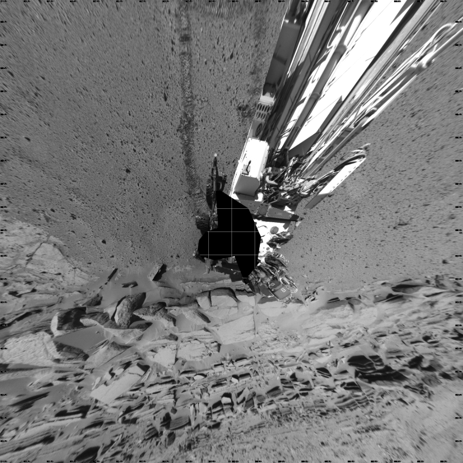 NASA's Mars rover Curiosity took 19 images in Gale Crater using its mast-mounted Left Navigation Camera (Navcam) to create this mosaic. The seam-corrected mosaic provides a vertical projection of the Martian surface near the rover, covering an area of 20 meters (north/south) by 20 meters (east/west). North is up in the image. This projection provides an overhead view, but introduces distortion for items not on the surface, such as large rocks and the rover itself.  Curiosity took the images on March 26, 2014, Sol 581 of the Mars Science Laboratory mission at drive 786, site number 30. The local mean solar time for the image exposures was 2 PM. Each Navcam image has a 45-degree field of view. CREDIT: NASA/JPL-Caltech