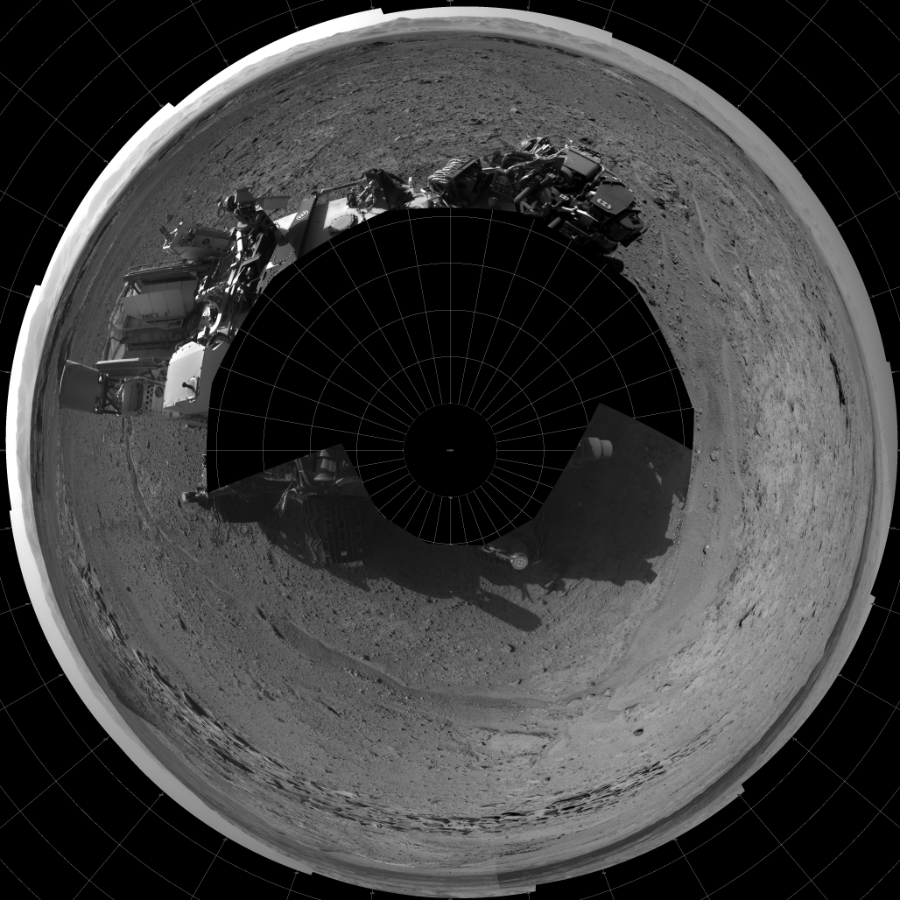 NASA's Mars rover Curiosity took 17 images in Gale Crater using its mast-mounted Left Navigation Camera (Navcam) to create this mosaic. The seam-corrected mosaic provides a polar stereographic projection panorama of the Martian surface with 0 degrees azimuth (measured clockwise from north) at the top of the image. Curiosity took the images on April 01, 2014, Sol 587 of the Mars Science Laboratory mission at drive 938, site number 30. The local mean solar time for the image exposures was from 2 PM to 3 PM. Each Navcam image has a 45-degree field of view. CREDIT: NASA/JPL-Caltech