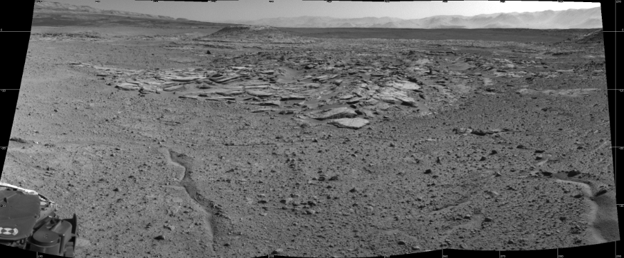 NASA's Mars rover Curiosity took 3 images in Gale Crater using its mast-mounted Left Navigation Camera (Navcam) to create this mosaic. The seam-corrected mosaic provides a 108-degree cylindrical projection panorama of the Martian surface centered at 238 degrees azimuth (measured clockwise from north). Curiosity took the images on April 03, 2014, Sol 589 of the Mars Science Laboratory mission at drive 0, site number 31. The local mean solar time for the image exposures was 2 PM. Each Navcam image has a 45 degree field of view. CREDIT: NASA/JPL-Caltech