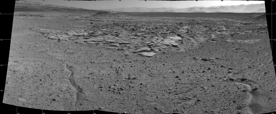 NASA's Mars rover Curiosity took 3 images in Gale Crater using its mast-mounted Right Navigation Camera (Navcam) to create this mosaic. The seam-corrected mosaic provides a 108-degree cylindrical projection panorama of the Martian surface centered at 238 degrees azimuth (measured clockwise from north). Curiosity took the images on April 03, 2014, Sol 589 of the Mars Science Laboratory mission at drive 0, site number 31. The local mean solar time for the image exposures was 2 PM. Each Navcam image has a 45 degree field of view. CREDIT: NASA/JPL-Caltech