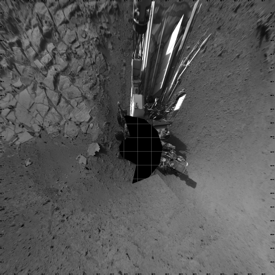 NASA's Mars rover Curiosity took 17 images in Gale Crater using its mast-mounted Left Navigation Camera (Navcam) to create this mosaic. The seam-corrected mosaic provides a vertical projection of the Martian surface near the rover, covering an area of 20 meters (north/south) by 20 meters (east/west). North is up in the image. This projection provides an overhead view, but introduces distortion for items not on the surface, such as large rocks and the rover itself.  Curiosity took the images on April 07, 2014, Sol 593 of the Mars Science Laboratory mission at drive 216, site number 31. The local mean solar time for the image exposures was from 2 PM to 4 PM. Each Navcam image has a 45-degree field of view. CREDIT: NASA/JPL-Caltech