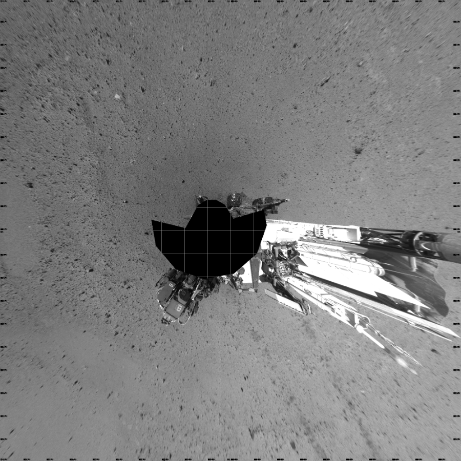 NASA's Mars rover Curiosity took 17 images in Gale Crater using its mast-mounted Left Navigation Camera (Navcam) to create this mosaic. The seam-corrected mosaic provides a vertical projection of the Martian surface near the rover, covering an area of 20 meters (north/south) by 20 meters (east/west). North is up in the image. This projection provides an overhead view, but introduces distortion for items not on the surface, such as large rocks and the rover itself. Curiosity took the images on May 27, 2014, Sol 641 of the Mars Science Laboratory mission at drive 308, site number 33. The local mean solar time for the image exposures was from 1 PM to 2 PM. Each Navcam image has a 45-degree field of view. CREDIT: NASA/JPL-Caltech