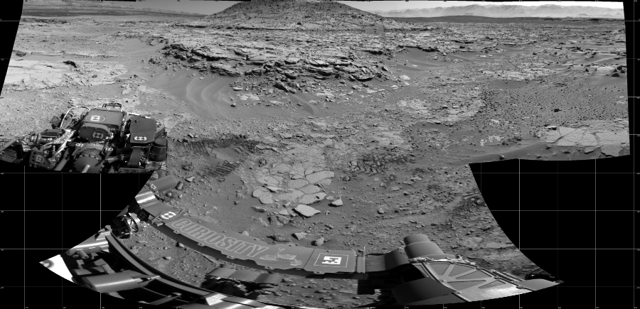 NASA's Mars rover Curiosity took 7 images in Gale Crater using its mast-mounted Left Navigation Camera (Navcam) to create this mosaic. The seam-corrected mosaic provides a 168-degree cylindrical projection panorama of the Martian surface centered at 248 degrees azimuth (measured clockwise from north). Curiosity took the images on April 12, 2014, Sol 597 of the Mars Science Laboratory mission at drive 718, site number 31. The local mean solar time for the image exposures was from 1 PM to 2 PM. Each Navcam image has a 45 degree field of view. CREDIT: NASA/JPL-Caltech