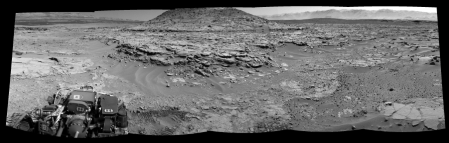 NASA's Mars rover Curiosity took 5 images in Gale Crater using its mast-mounted Left Navigation Camera (Navcam) to create this mosaic. The seam-corrected mosaic provides a 168-degree cylindrical-perspective projection panorama of the Martian surface suitable for stereo viewing, centered at 349 degrees azimuth (measured clockwise from north). This single-eye view must be combined with the partner right image to be viewed in stereo.  Curiosity took the images on April 12, 2014, Sol 597 of the Mars Science Laboratory mission at drive 718, site number 31. The local mean solar time for the image exposures was 1 PM. Each Navcam image has a 45-degree field of view. CREDIT: NASA/JPL-Caltech