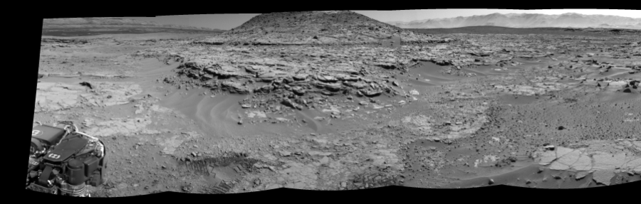 NASA's Mars rover Curiosity took 5 images in Gale Crater using its mast-mounted Right Navigation Camera (Navcam) to create this mosaic. The seam-corrected mosaic provides a 168-degree cylindrical-perspective projection panorama of the Martian surface suitable for stereo viewing, centered at 343 degrees azimuth (measured clockwise from north). This single-eye view must be combined with the partner left image to be viewed in stereo.  Curiosity took the images on April 12, 2014, Sol 597 of the Mars Science Laboratory mission at drive 718, site number 31. The local mean solar time for the image exposures was 1 PM. Each Navcam image has a 45-degree field of view. CREDIT: NASA/JPL-Caltech