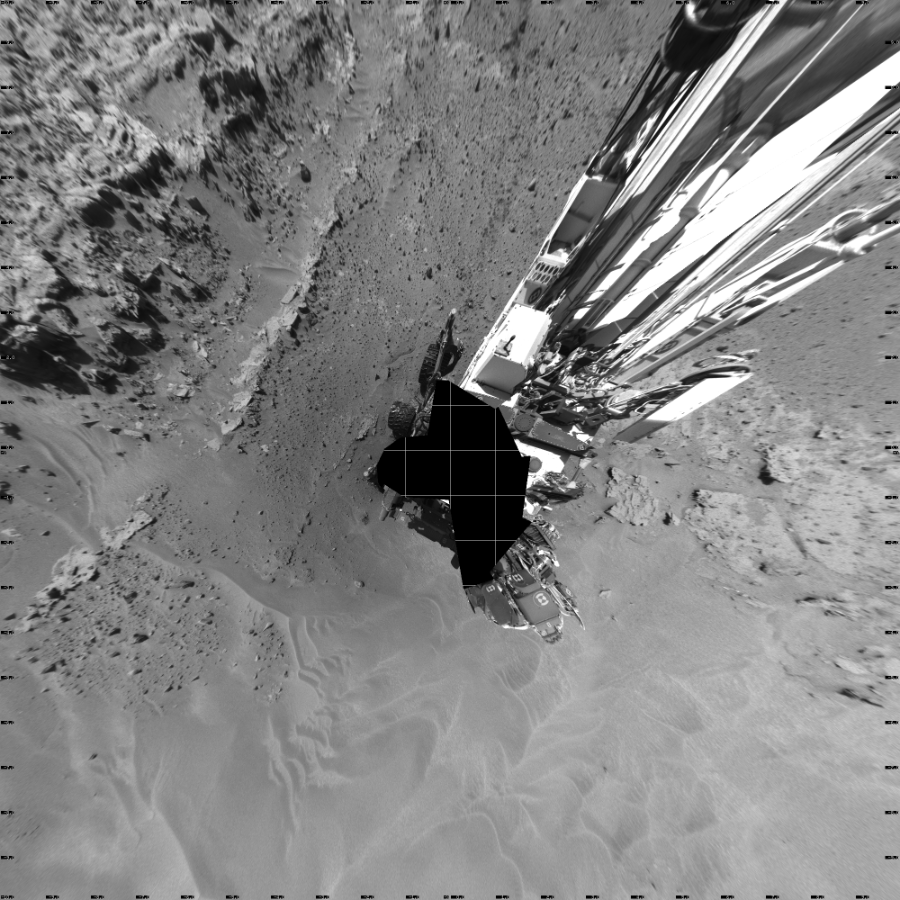 NASA's Mars rover Curiosity took 19 images in Gale Crater using its mast-mounted Left Navigation Camera (Navcam) to create this mosaic. The seam-corrected mosaic provides a vertical projection of the Martian surface near the rover, covering an area of 20 meters (north/south) by 20 meters (east/west). North is up in the image. This projection provides an overhead view, but introduces distortion for items not on the surface, such as large rocks and the rover itself.  Curiosity took the images on April 18, 2014, Sol 603 of the Mars Science Laboratory mission at drive 1094, site number 31. The local mean solar time for the image exposures was 1 PM. Each Navcam image has a 45-degree field of view. CREDIT: NASA/JPL-Caltech