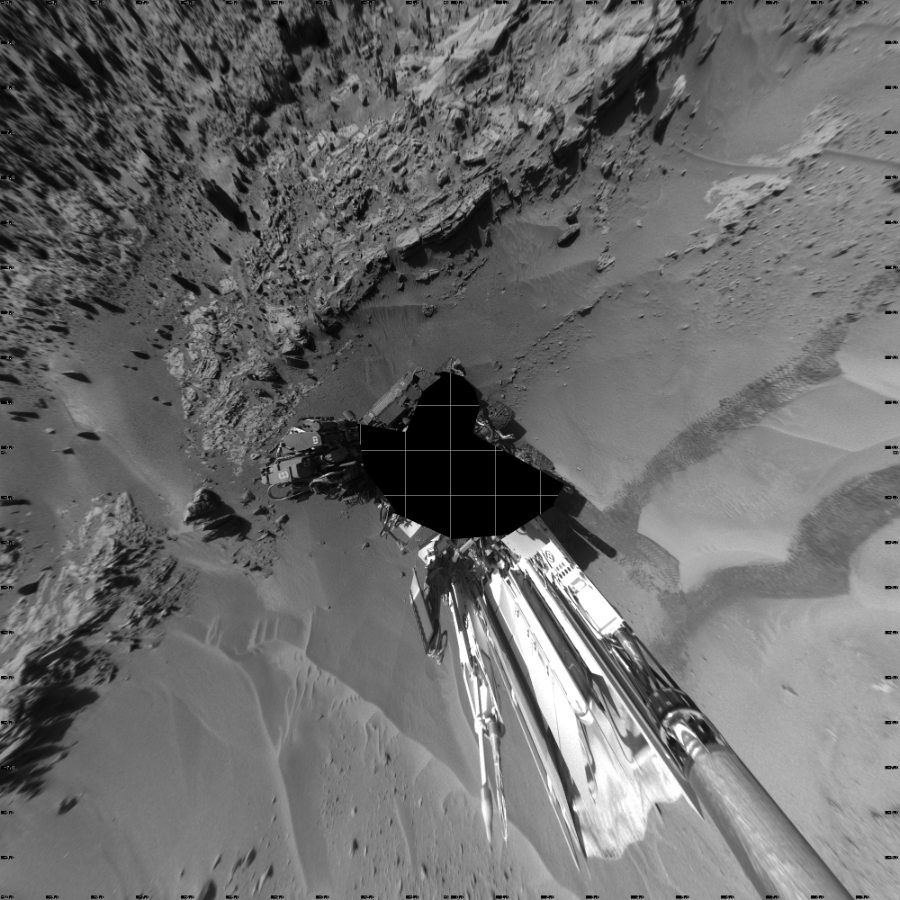 NASA's Mars rover Curiosity took 19 images in Gale Crater using its mast-mounted Left Navigation Camera (Navcam) to create this mosaic. The seam-corrected mosaic provides a vertical projection of the Martian surface near the rover, covering an area of 20 meters (north/south) by 20 meters (east/west). North is up in the image. This projection provides an overhead view, but introduces distortion for items not on the surface, such as large rocks and the rover itself.  Curiosity took the images on April 21, 2014, Sol 606 of the Mars Science Laboratory mission at drive 1256, site number 31. The local mean solar time for the image exposures was from 2 PM to 3 PM. Each Navcam image has a 45-degree field of view. CREDIT: NASA/JPL-Caltech