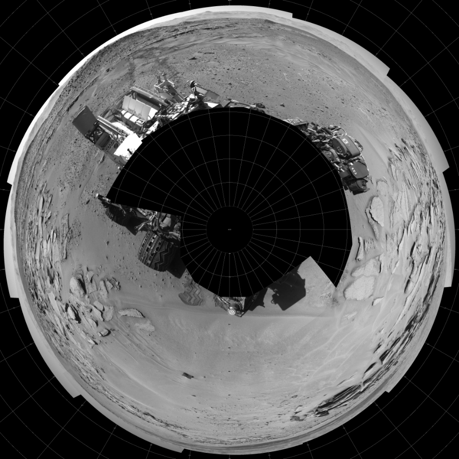 NASA's Mars rover Curiosity took 17 images in Gale Crater using its mast-mounted Left Navigation Camera (Navcam) to create this mosaic. The seam-corrected mosaic provides a polar stereographic projection panorama of the Martian surface with 0 degrees azimuth (measured clockwise from north) at the top of the image. Curiosity took the images on May 15, 2014, Sol 630 of the Mars Science Laboratory mission at drive 1472, site number 31. The local mean solar time for the image exposures was 1 PM. Each Navcam image has a 45-degree field of view. CREDIT: NASA/JPL-Caltech