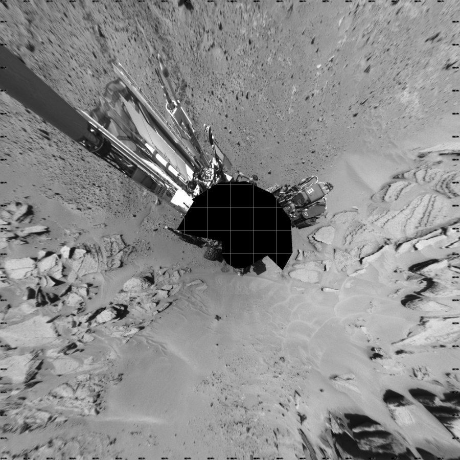 NASA's Mars rover Curiosity took 17 images in Gale Crater using its mast-mounted Left Navigation Camera (Navcam) to create this mosaic. The seam-corrected mosaic provides a vertical projection of the Martian surface near the rover, covering an area of 20 meters (north/south) by 20 meters (east/west). North is up in the image. This projection provides an overhead view, but introduces distortion for items not on the surface, such as large rocks and the rover itself.  Curiosity took the images on May 15, 2014, Sol 630 of the Mars Science Laboratory mission at drive 1472, site number 31. The local mean solar time for the image exposures was 1 PM. Each Navcam image has a 45-degree field of view. CREDIT: NASA/JPL-Caltech