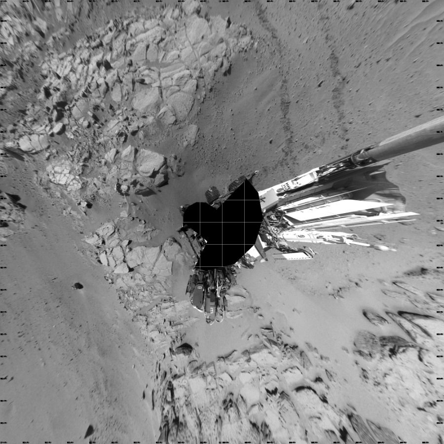 NASA's Mars rover Curiosity took 18 images in Gale Crater using its mast-mounted Left Navigation Camera (Navcam) to create this mosaic. The seam-corrected mosaic provides a vertical projection of the Martian surface near the rover, covering an area of 20 meters (north/south) by 20 meters (east/west). North is up in the image. This projection provides an overhead view, but introduces distortion for items not on the surface, such as large rocks and the rover itself.  Curiosity took the images on May 17, 2014, Sol 631 of the Mars Science Laboratory mission at drive 0, site number 32. The local mean solar time for the image exposures was from 1 PM to 2 PM. Each Navcam image has a 45-degree field of view. CREDIT: NASA/JPL-Caltech