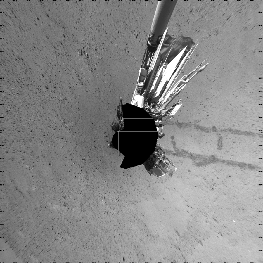 NASA's Mars rover Curiosity took 17 images in Gale Crater using its mast-mounted Left Navigation Camera (Navcam) to create this mosaic. The seam-corrected mosaic provides a vertical projection of the Martian surface near the rover, covering an area of 20 meters (north/south) by 20 meters (east/west). North is up in the image. This projection provides an overhead view, but introduces distortion for items not on the surface, such as large rocks and the rover itself.  Curiosity took the images on May 21, 2014, Sol 635 of the Mars Science Laboratory mission at drive 794, site number 32. The local mean solar time for the image exposures was 2 PM. Each Navcam image has a 45-degree field of view. CREDIT: NASA/JPL-Caltech