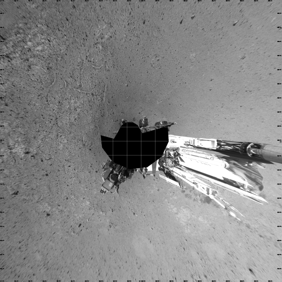 NASA's Mars rover Curiosity took 17 images in Gale Crater using its mast-mounted Left Navigation Camera (Navcam) to create this mosaic. The seam-corrected mosaic provides a vertical projection of the Martian surface near the rover, covering an area of 20 meters (north/south) by 20 meters (east/west). North is up in the image. This projection provides an overhead view, but introduces distortion for items not on the surface, such as large rocks and the rover itself. Curiosity took the images on May 22, 2014, Sol 636 of the Mars Science Laboratory mission at drive 1020, site number 32. The local mean solar time for the image exposures was 2 PM. Each Navcam image has a 45-degree field of view. CREDIT: NASA/JPL-Caltech