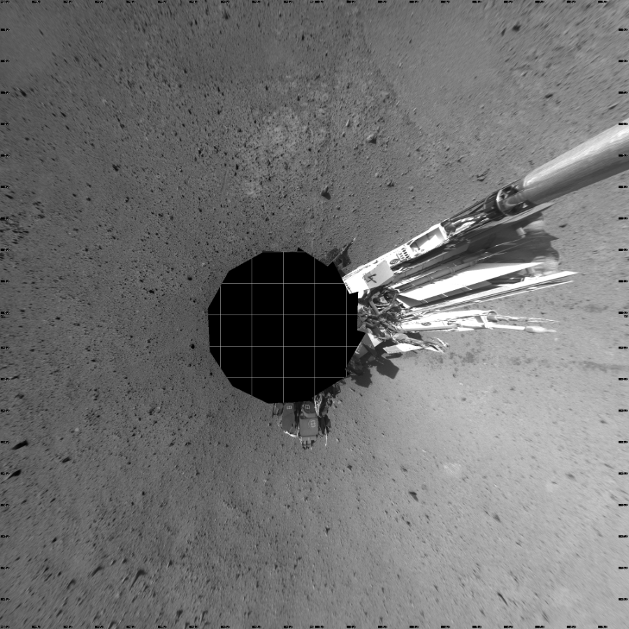 NASA's Mars rover Curiosity took 12 images in Gale Crater using its mast-mounted Left Navigation Camera (Navcam) to create this mosaic. The seam-corrected mosaic provides a vertical projection of the Martian surface near the rover, covering an area of 20 meters (north/south) by 20 meters (east/west). North is up in the image. This projection provides an overhead view, but introduces distortion for items not on the surface, such as large rocks and the rover itself.  Curiosity took the images on May 23, 2014, Sol 637 of the Mars Science Laboratory mission at drive 0, site number 33. The local mean solar time for the image exposures was from 1 PM to 3 PM. Each Navcam image has a 45-degree field of view. CREDIT: NASA/JPL-Caltech