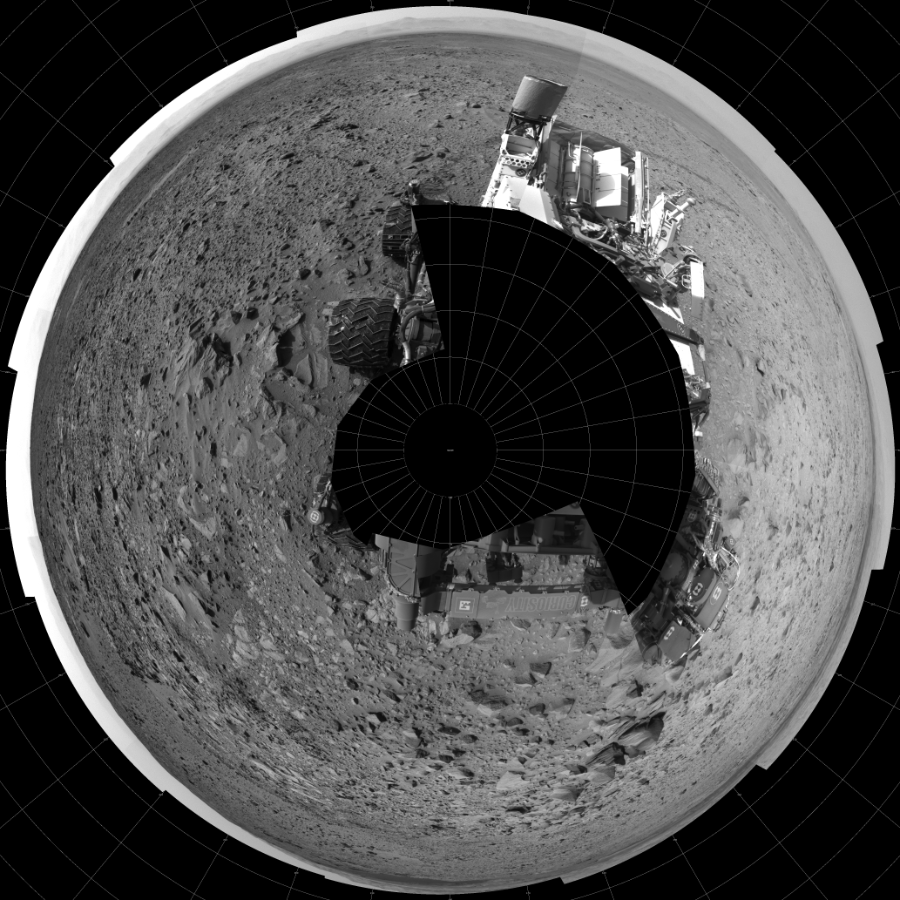 NASA's Mars rover Curiosity took 19 images in Gale Crater using its mast-mounted Left Navigation Camera (Navcam) to create this mosaic. The seam-corrected mosaic provides a polar stereographic projection panorama of the Martian surface with 0 degrees azimuth (measured clockwise from north) at the top of the image. Curiosity took the images on July 18, 2014, Sol 692 of the Mars Science Laboratory mission at drive 1176, site number 39. The local mean solar time for the image exposures was 2 PM. Each Navcam image has a 45-degree field of view. CREDIT: NASA/JPL-Caltech
