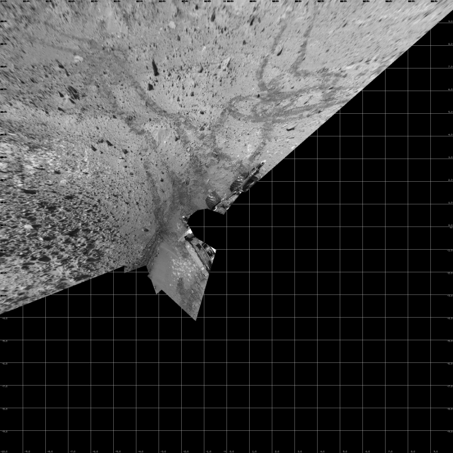NASA's Mars rover Curiosity took 12 images in Gale Crater using its mast-mounted Left Navigation Camera (Navcam) to create this mosaic. The seam-corrected mosaic provides a vertical projection of the Martian surface near the rover, covering an area of 20 meters (north/south) by 20 meters (east/west). North is up in the image. This projection provides an overhead view, but introduces distortion for items not on the surface, such as large rocks and the rover itself.  Curiosity took the images on August 15, 2014, Sol 719 of the Mars Science Laboratory mission at drive 1378, site number 40. The local mean solar time for the image exposures was 1 PM. Each Navcam image has a 45-degree field of view. CREDIT: NASA/JPL-Caltech