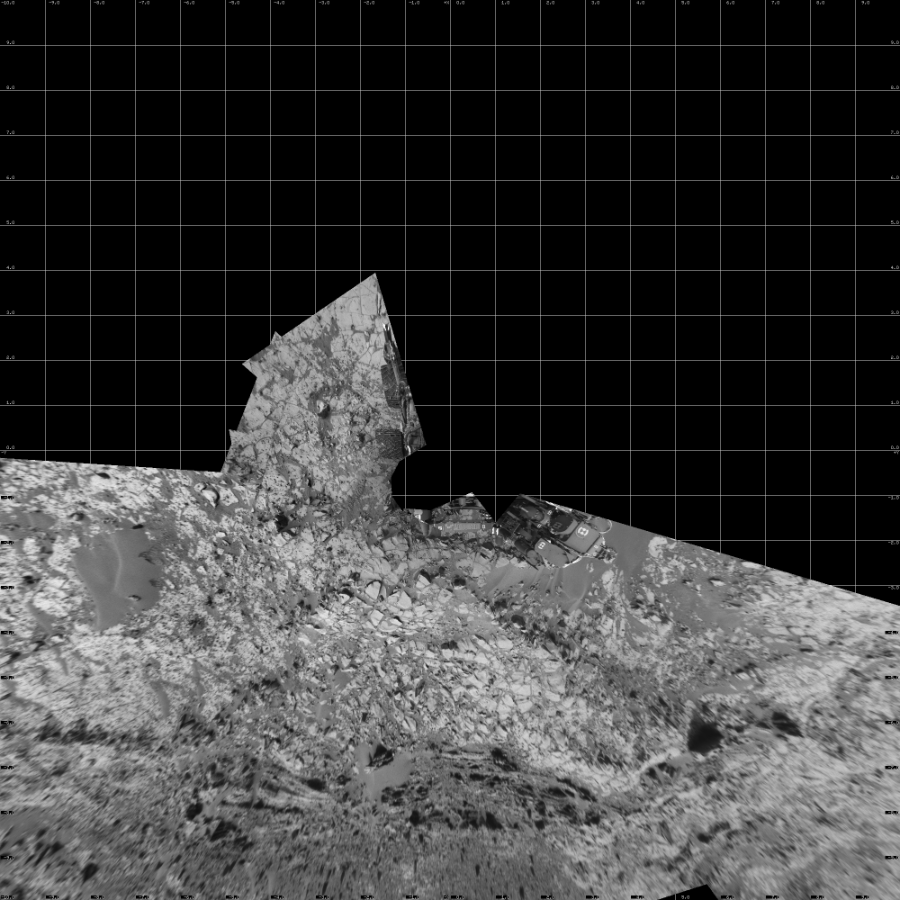 NASA's Mars rover Curiosity took 12 images in Gale Crater using its mast-mounted Left Navigation Camera (Navcam) to create this mosaic. The seam-corrected mosaic provides a vertical projection of the Martian surface near the rover, covering an area of 20 meters (north/south) by 20 meters (east/west). North is up in the image. This projection provides an overhead view, but introduces distortion for items not on the surface, such as large rocks and the rover itself.  Curiosity took the images on November 24, 2014, Sol 817 of the Mars Science Laboratory mission at drive 1828, site number 44. The local mean solar time for the image exposures was 1 PM. Each Navcam image has a 45-degree field of view. CREDIT: NASA/JPL-Caltech