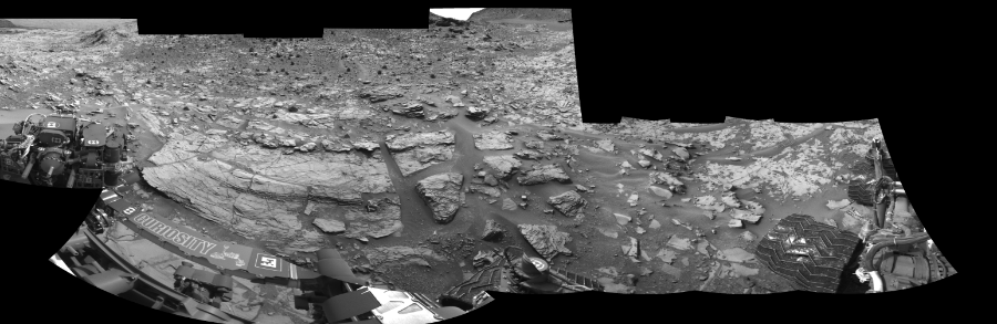 NASA's Mars rover Curiosity took 12 images in Gale Crater using its mast-mounted Left Navigation Camera (Navcam) to create this mosaic. The seam-corrected mosaic provides a 288-degree cylindrical-perspective projection panorama of the Martian surface suitable for stereo viewing, centered at 62 degrees azimuth (measured clockwise from north). This single-eye view must be combined with the partner right image to be viewed in stereo.  Curiosity took the images on December 03, 2014, Sol 826 of the Mars Science Laboratory mission at drive 2062, site number 44. The local mean solar time for the image exposures was 1 PM. Each Navcam image has a 45-degree field of view. CREDIT: NASA/JPL-Caltech