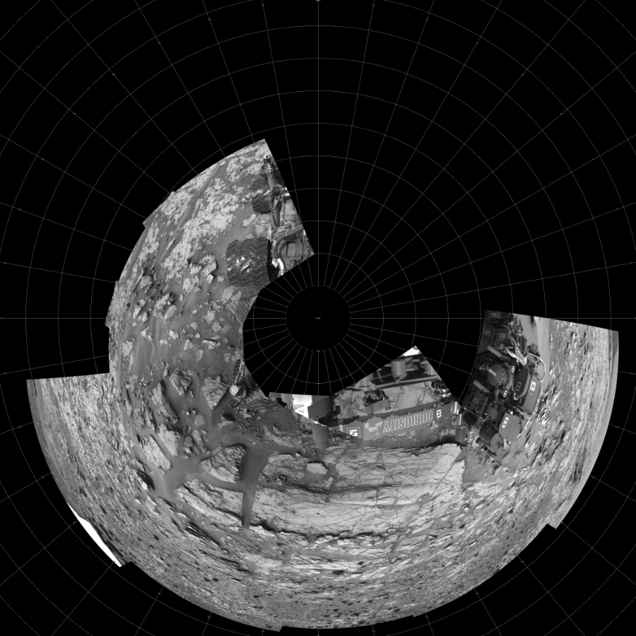NASA's Mars rover Curiosity took 12 images in Gale Crater using its mast-mounted Left Navigation Camera (Navcam) to create this mosaic. The seam-corrected mosaic provides a polar stereographic projection panorama of the Martian surface with 0 degrees azimuth (measured clockwise from north) at the top of the image. Curiosity took the images on December 03, 2014, Sol 826 of the Mars Science Laboratory mission at drive 2062, site number 44. The local mean solar time for the image exposures was 1 PM. Each Navcam image has a 45-degree field of view. CREDIT: NASA/JPL-Caltech