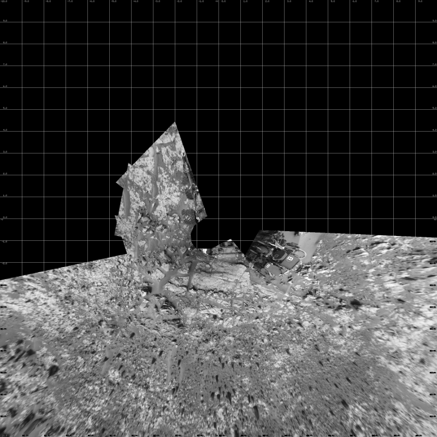 NASA's Mars rover Curiosity took 12 images in Gale Crater using its mast-mounted Left Navigation Camera (Navcam) to create this mosaic. The seam-corrected mosaic provides a vertical projection of the Martian surface near the rover, covering an area of 20 meters (north/south) by 20 meters (east/west). North is up in the image. This projection provides an overhead view, but introduces distortion for items not on the surface, such as large rocks and the rover itself.  Curiosity took the images on December 03, 2014, Sol 826 of the Mars Science Laboratory mission at drive 2062, site number 44. The local mean solar time for the image exposures was 1 PM. Each Navcam image has a 45-degree field of view. CREDIT: NASA/JPL-Caltech