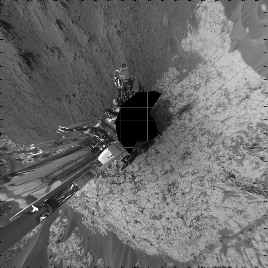 NASA's Mars rover Curiosity took 22 images in Gale Crater using its mast-mounted Left Navigation Camera (Navcam) to create this mosaic. The seam-corrected mosaic provides a vertical projection of the Martian surface near the rover, covering an area of 20 meters (north/south) by 20 meters (east/west). North is up in the image. This projection provides an overhead view, but introduces distortion for items not on the surface, such as large rocks and the rover itself.  Curiosity took the images on January 09, 2015, Sol 862 of the Mars Science Laboratory mission at drive 2958, site number 44. The local mean solar time for the image exposures was 4 PM. Each Navcam image has a 45-degree field of view. CREDIT: NASA/JPL-Caltech