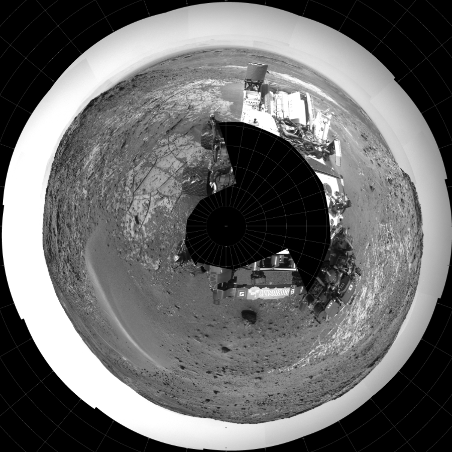 NASA's Mars rover Curiosity took 31 images in Gale Crater using its mast-mounted Left Navigation Camera (Navcam) to create this mosaic. The seam-corrected mosaic provides a polar stereographic projection panorama of the Martian surface with 0 degrees azimuth (measured clockwise from north) at the top of the image. Curiosity took the images on March 30, 2015, Sol 940 of the Mars Science Laboratory mission at drive 996, site number 45. The local mean solar time for the image exposures was 3 PM. Each Navcam image has a 45-degree field of view. CREDIT: NASA/JPL-Caltech