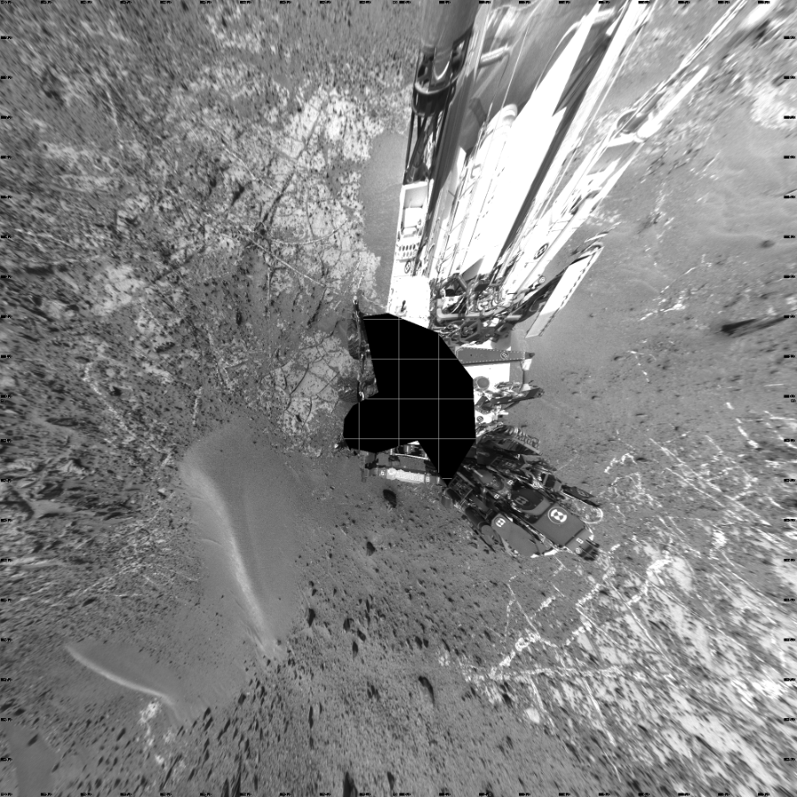 NASA's Mars rover Curiosity took 31 images in Gale Crater using its mast-mounted Left Navigation Camera (Navcam) to create this mosaic. The seam-corrected mosaic provides a vertical projection of the Martian surface near the rover, covering an area of 20 meters (north/south) by 20 meters (east/west). North is up in the image. This projection provides an overhead view, but introduces distortion for items not on the surface, such as large rocks and the rover itself.  Curiosity took the images on March 30, 2015, Sol 940 of the Mars Science Laboratory mission at drive 996, site number 45. The local mean solar time for the image exposures was 3 PM. Each Navcam image has a 45-degree field of view. CREDIT: NASA/JPL-Caltech
