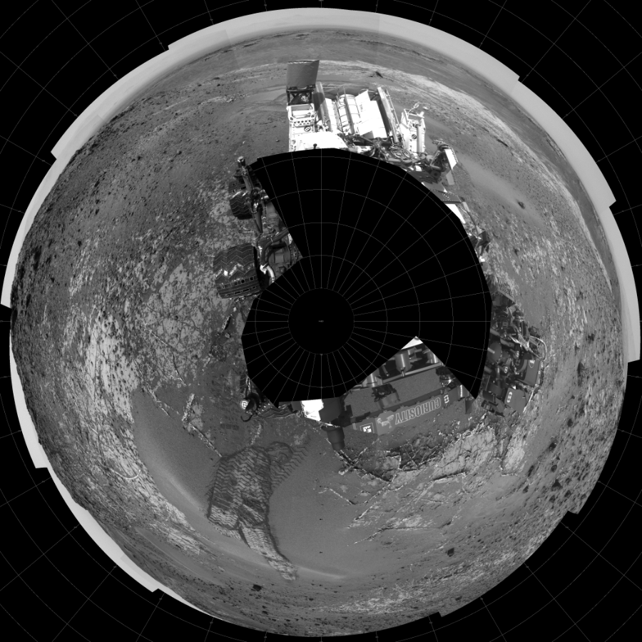 NASA's Mars rover Curiosity took 19 images in Gale Crater using its mast-mounted Left Navigation Camera (Navcam) to create this mosaic. The seam-corrected mosaic provides a polar stereographic projection panorama of the Martian surface with 0 degrees azimuth (measured clockwise from north) at the top of the image. Curiosity took the images on April 03, 2015, Sol 944 of the Mars Science Laboratory mission at drive 1108, site number 45. The local mean solar time for the image exposures was 2 PM. Each Navcam image has a 45-degree field of view. CREDIT: NASA/JPL-Caltech