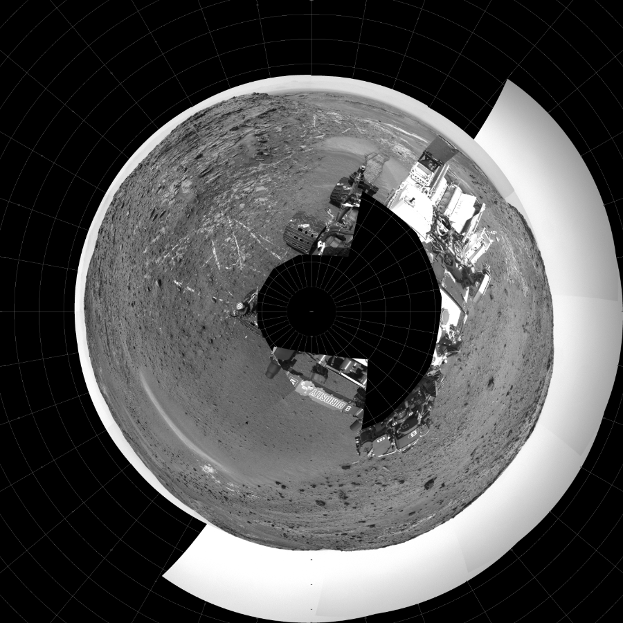 NASA's Mars rover Curiosity took 23 images in Gale Crater using its mast-mounted Left Navigation Camera (Navcam) to create this mosaic. The seam-corrected mosaic provides a polar stereographic projection panorama of the Martian surface with 0 degrees azimuth (measured clockwise from north) at the top of the image. Curiosity took the images on April 08, 2015, Sol 949 of the Mars Science Laboratory mission at drive 1276, site number 45. The local mean solar time for the image exposures was from 1 PM to 2 PM. Each Navcam image has a 45-degree field of view. CREDIT: NASA/JPL-Caltech