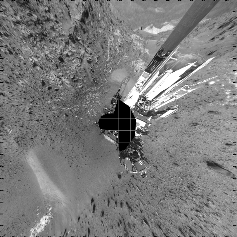 NASA's Mars rover Curiosity took 23 images in Gale Crater using its mast-mounted Left Navigation Camera (Navcam) to create this mosaic. The seam-corrected mosaic provides a vertical projection of the Martian surface near the rover, covering an area of 20 meters (north/south) by 20 meters (east/west). North is up in the image. This projection provides an overhead view, but introduces distortion for items not on the surface, such as large rocks and the rover itself.  Curiosity took the images on April 08, 2015, Sol 949 of the Mars Science Laboratory mission at drive 1276, site number 45. The local mean solar time for the image exposures was from 1 PM to 2 PM. Each Navcam image has a 45-degree field of view. CREDIT: NASA/JPL-Caltech