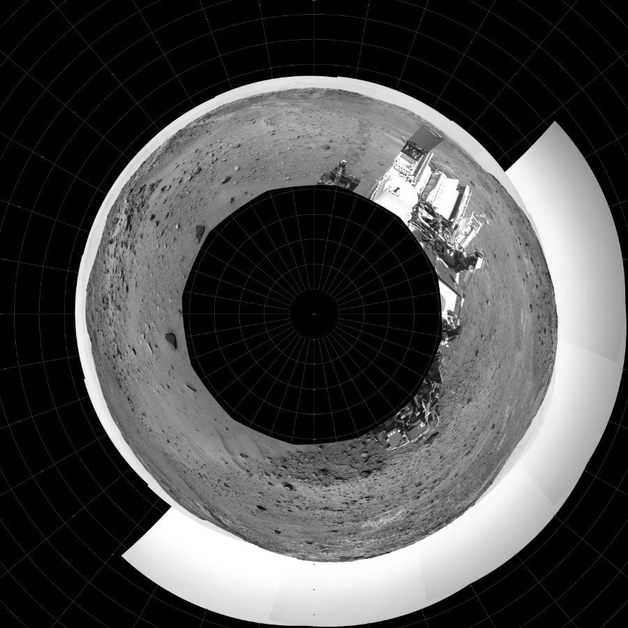 NASA's Mars rover Curiosity took 17 images in Gale Crater using its mast-mounted Left Navigation Camera (Navcam) to create this mosaic. The seam-corrected mosaic provides a polar stereographic projection panorama of the Martian surface with 0 degrees azimuth (measured clockwise from north) at the top of the image. Curiosity took the images on April 09, 2015, Sol 950 of the Mars Science Laboratory mission at drive 1558, site number 45. The local mean solar time for the image exposures was 1 PM. Each Navcam image has a 45-degree field of view. CREDIT: NASA/JPL-Caltech