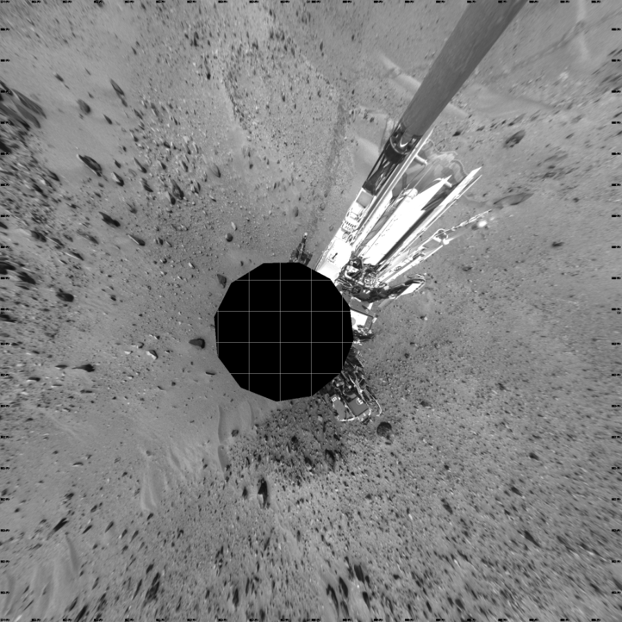 NASA's Mars rover Curiosity took 17 images in Gale Crater using its mast-mounted Left Navigation Camera (Navcam) to create this mosaic. The seam-corrected mosaic provides a vertical projection of the Martian surface near the rover, covering an area of 20 meters (north/south) by 20 meters (east/west). North is up in the image. This projection provides an overhead view, but introduces distortion for items not on the surface, such as large rocks and the rover itself.  Curiosity took the images on April 09, 2015, Sol 950 of the Mars Science Laboratory mission at drive 1558, site number 45. The local mean solar time for the image exposures was 1 PM. Each Navcam image has a 45-degree field of view. CREDIT: NASA/JPL-Caltech