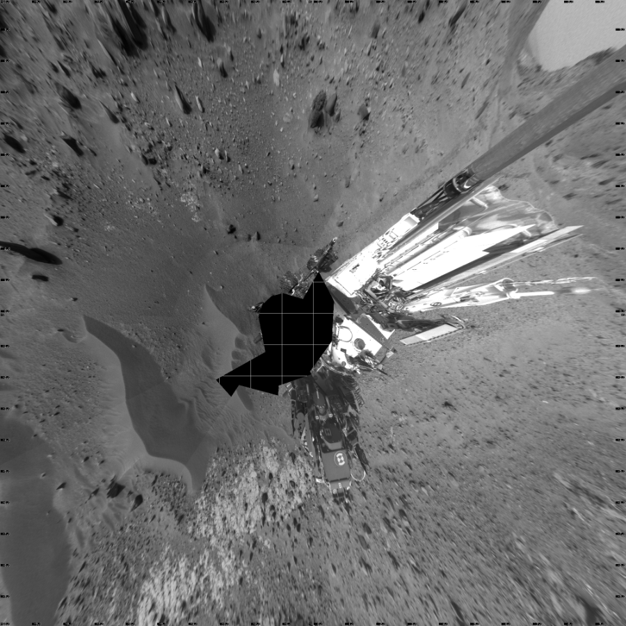 NASA's Mars rover Curiosity took 18 images in Gale Crater using its mast-mounted Left Navigation Camera (Navcam) to create this mosaic. The seam-corrected mosaic provides a vertical projection of the Martian surface near the rover, covering an area of 20 meters (north/south) by 20 meters (east/west). North is up in the image. This projection provides an overhead view, but introduces distortion for items not on the surface, such as large rocks and the rover itself. Curiosity took the images on April 10, 2015, Sol 951 of the Mars Science Laboratory mission at drive 1696, site number 45. The local mean solar time for the image exposures was 4 PM. Each Navcam image has a 45-degree field of view. CREDIT: NASA/JPL-Caltech