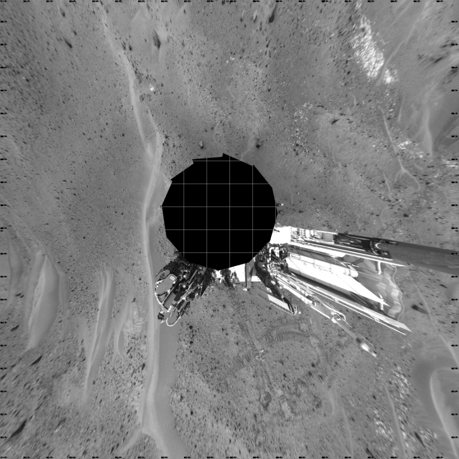 NASA's Mars rover Curiosity took 17 images in Gale Crater using its mast-mounted Left Navigation Camera (Navcam) to create this mosaic. The seam-corrected mosaic provides a vertical projection of the Martian surface near the rover, covering an area of 20 meters (north/south) by 20 meters (east/west). North is up in the image. This projection provides an overhead view, but introduces distortion for items not on the surface, such as large rocks and the rover itself.  Curiosity took the images on April 15, 2015, Sol 956 of the Mars Science Laboratory mission at drive 472, site number 46. The local mean solar time for the image exposures was 1 PM. Each Navcam image has a 45-degree field of view. CREDIT: NASA/JPL-Caltech