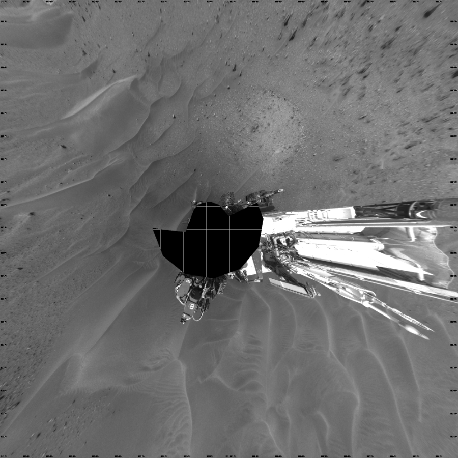 NASA's Mars rover Curiosity took 17 images in Gale Crater using its mast-mounted Left Navigation Camera (Navcam) to create this mosaic. The seam-corrected mosaic provides a vertical projection of the Martian surface near the rover, covering an area of 20 meters (north/south) by 20 meters (east/west). North is up in the image. This projection provides an overhead view, but introduces distortion for items not on the surface, such as large rocks and the rover itself.  Curiosity took the images on April 17, 2015, Sol 957 of the Mars Science Laboratory mission at drive 934, site number 46. The local mean solar time for the image exposures was 3 PM. Each Navcam image has a 45-degree field of view. CREDIT: NASA/JPL-Caltech